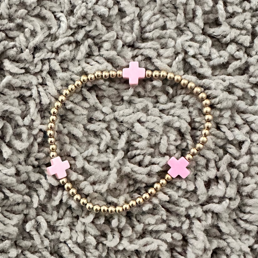 Hot pink cross enewton. 3mm gold beads.